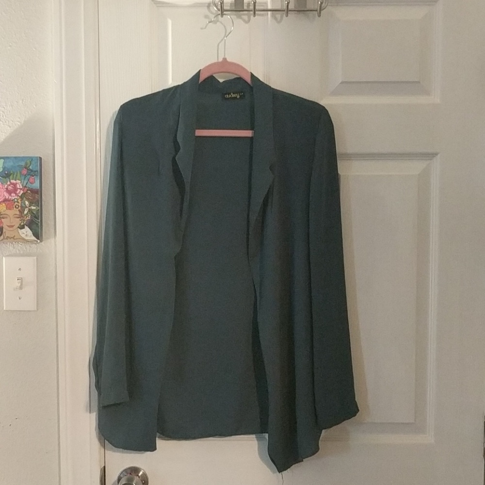 Translucent turquoise blue blazer